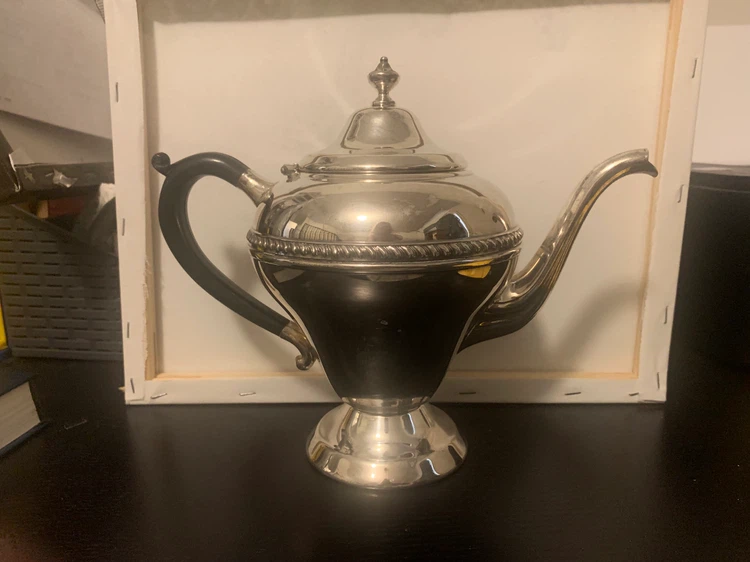 Antique Silver Teapot with Black Handle