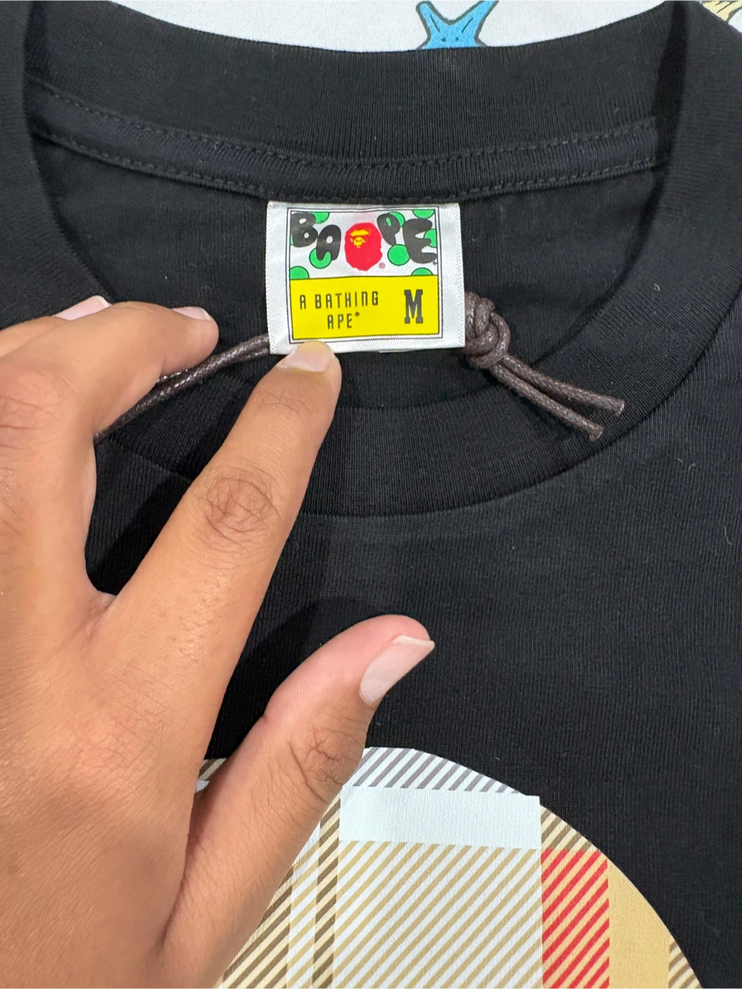 A 100% cotton T-Shirt featuring a Bape logo. - photo 4