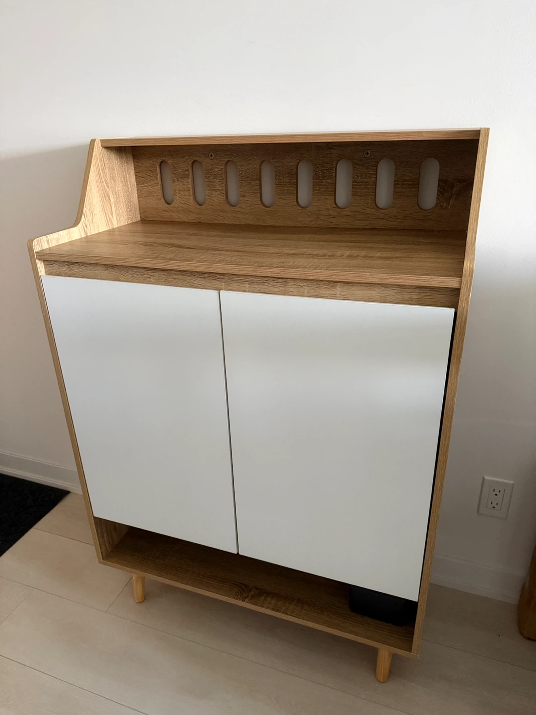 Two-door cabinet with open top shelf