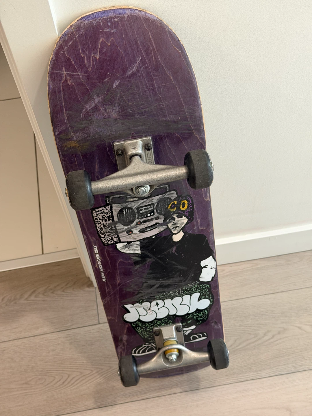 Purple Skateboard with Graphics