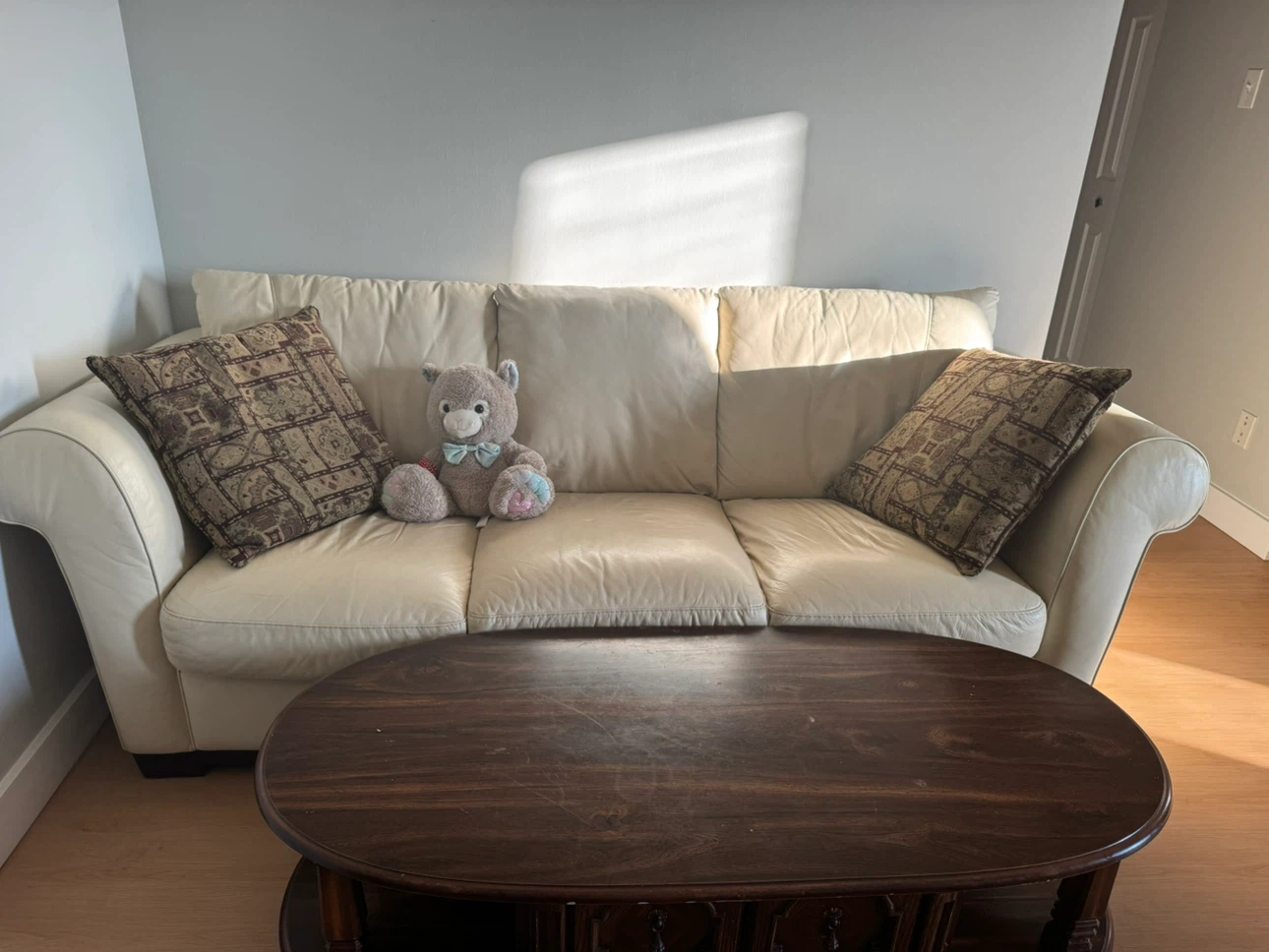 Cream Leather Sofa with Decorative Pillows - photo 2