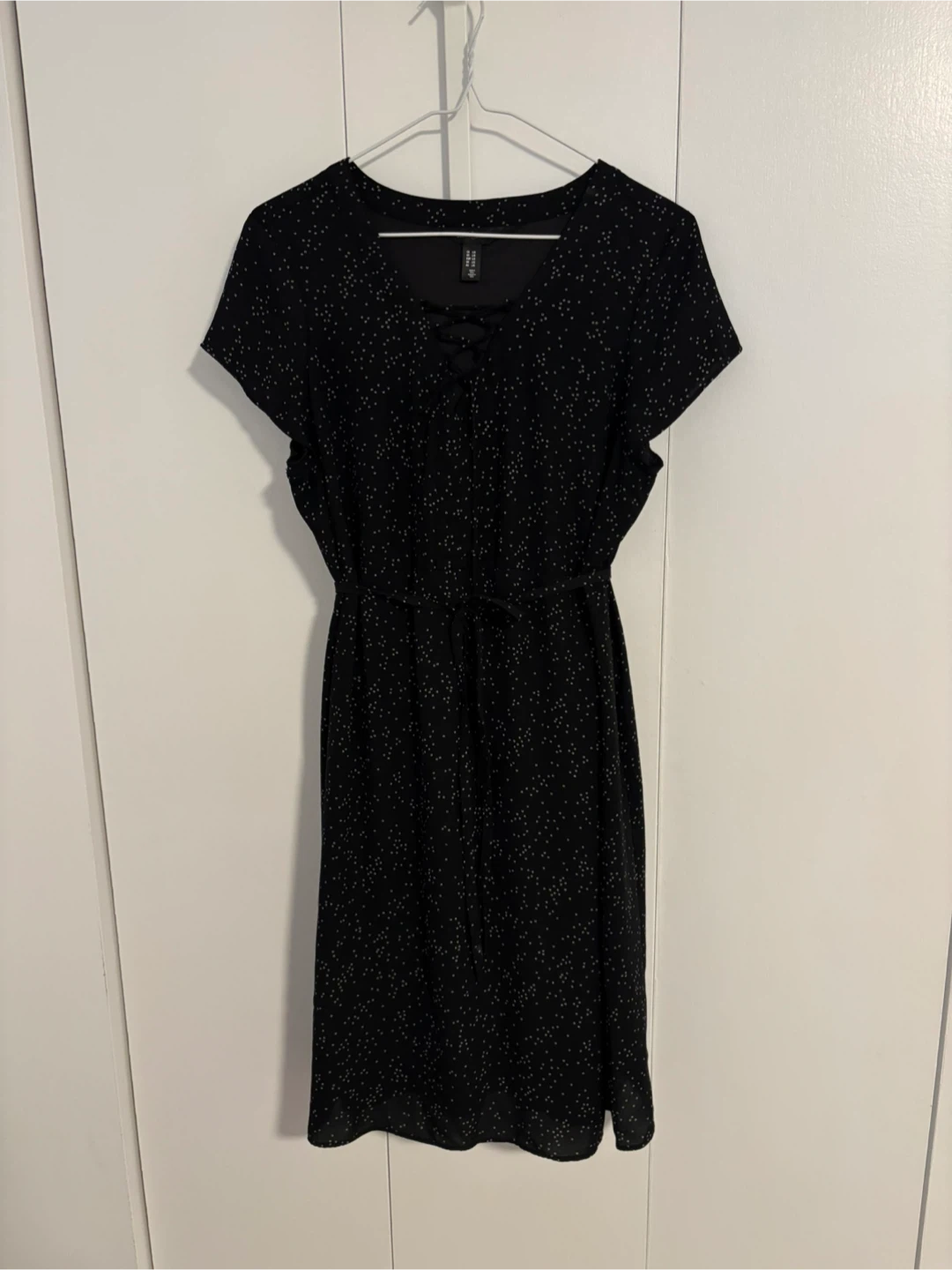 Midi dress with white polka dot print.