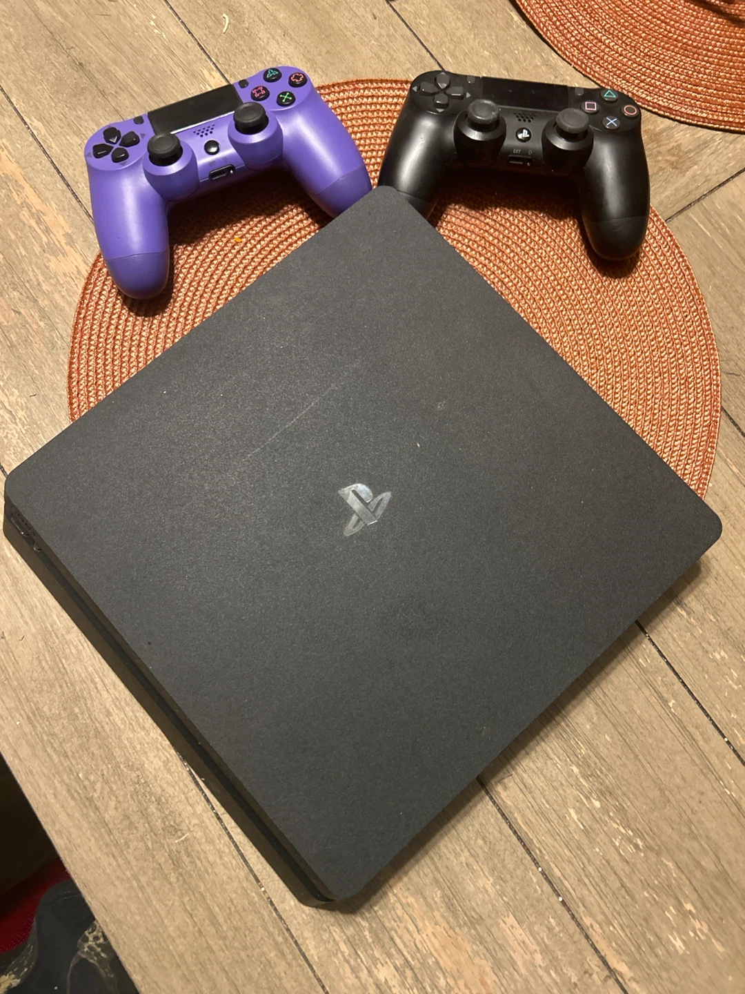 Sony PlayStation 4 Slim Console with Two Controllers