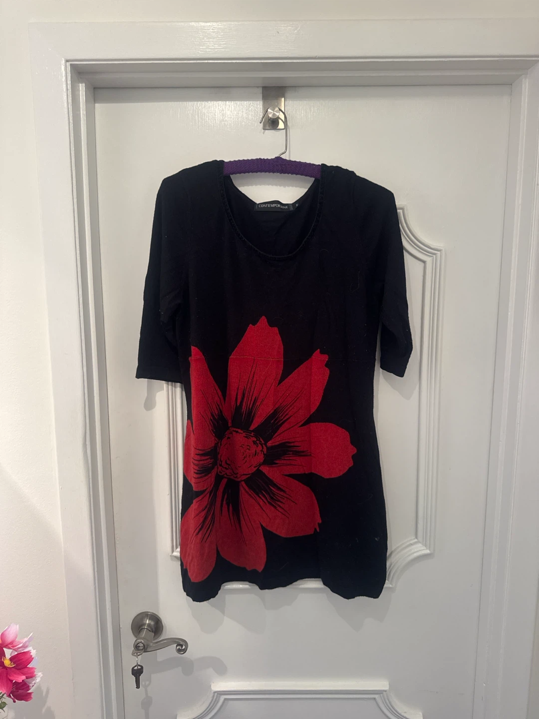 Contemporaine black top with red flower graphic