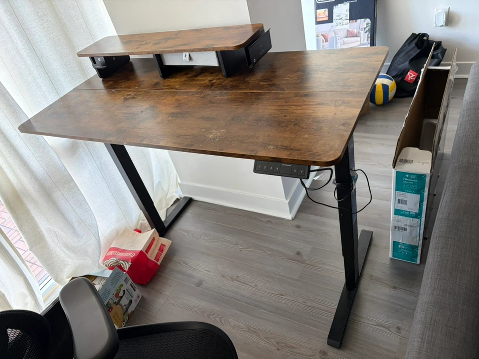 Adjustable standing desk with monitor stand