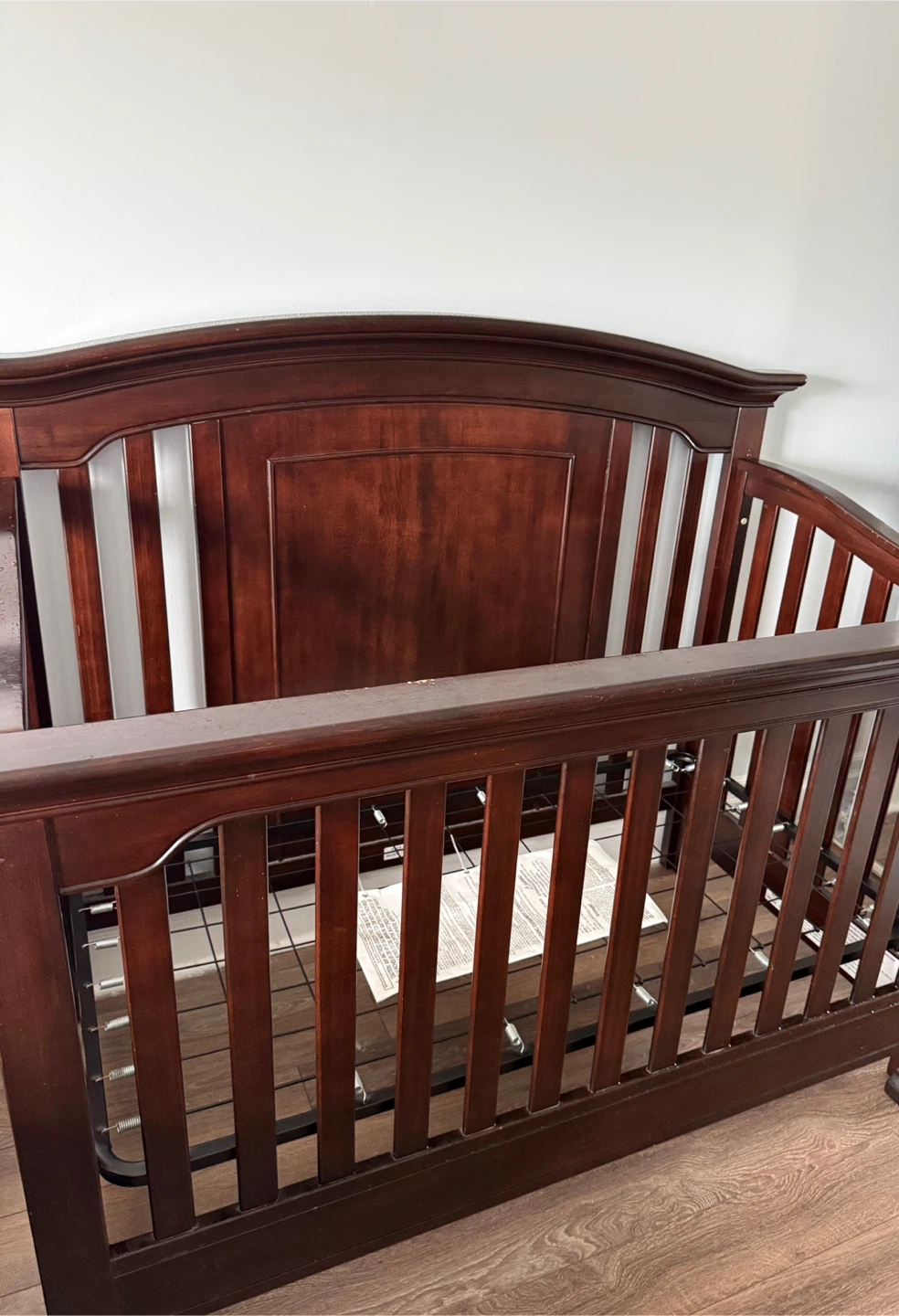 Dark wood convertible baby crib