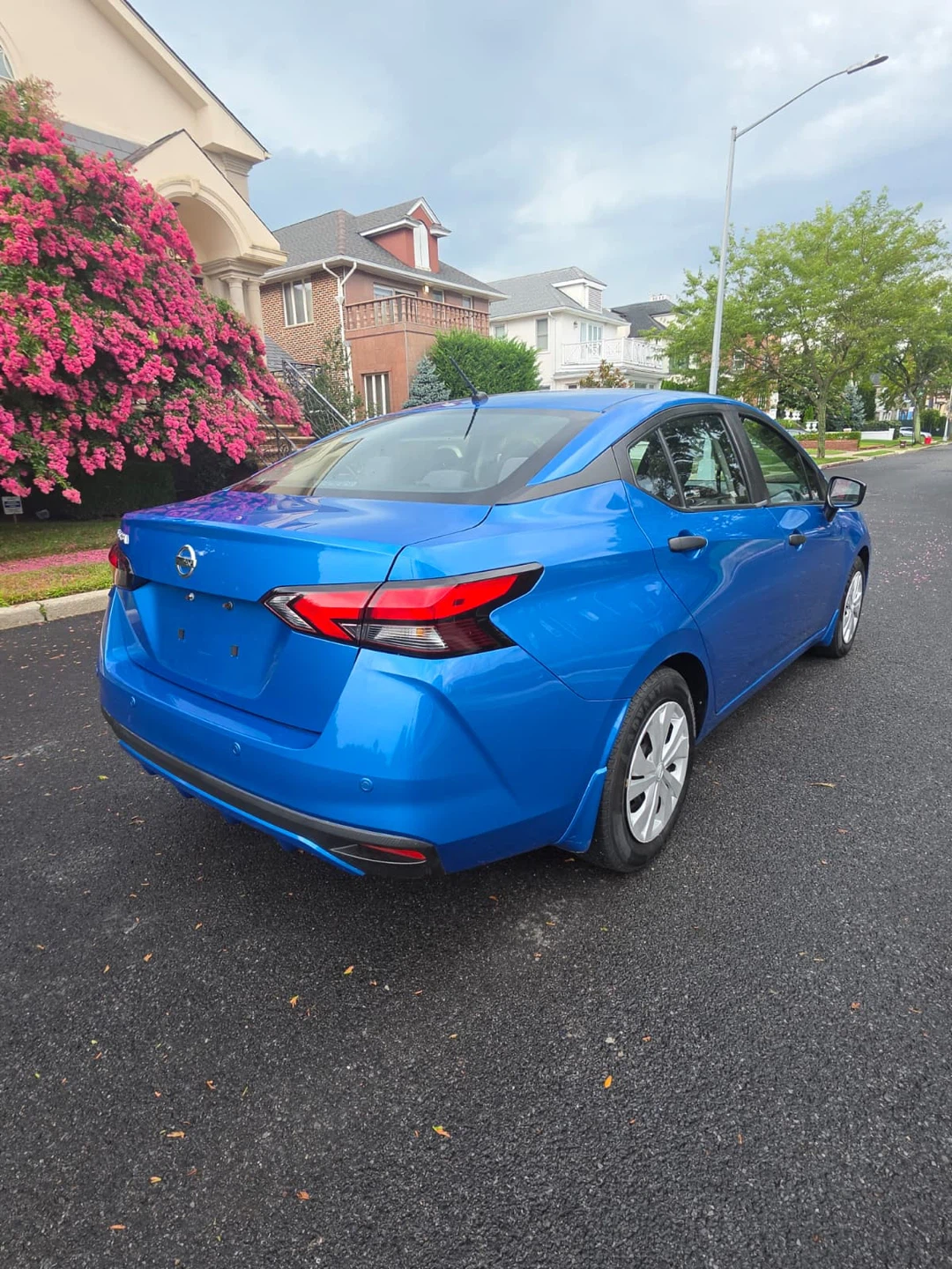 Blue Nissan Versa Sedan - photo 3