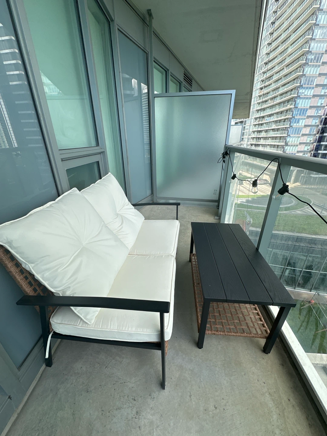 Wicker patio loveseat with coffee table