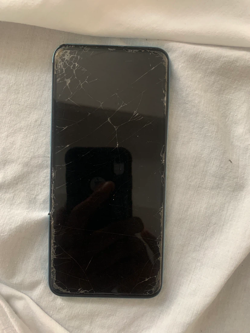 Realme smartphone with cracked screen
