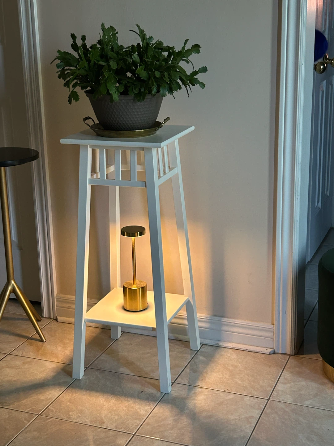 White plant stand with shelf