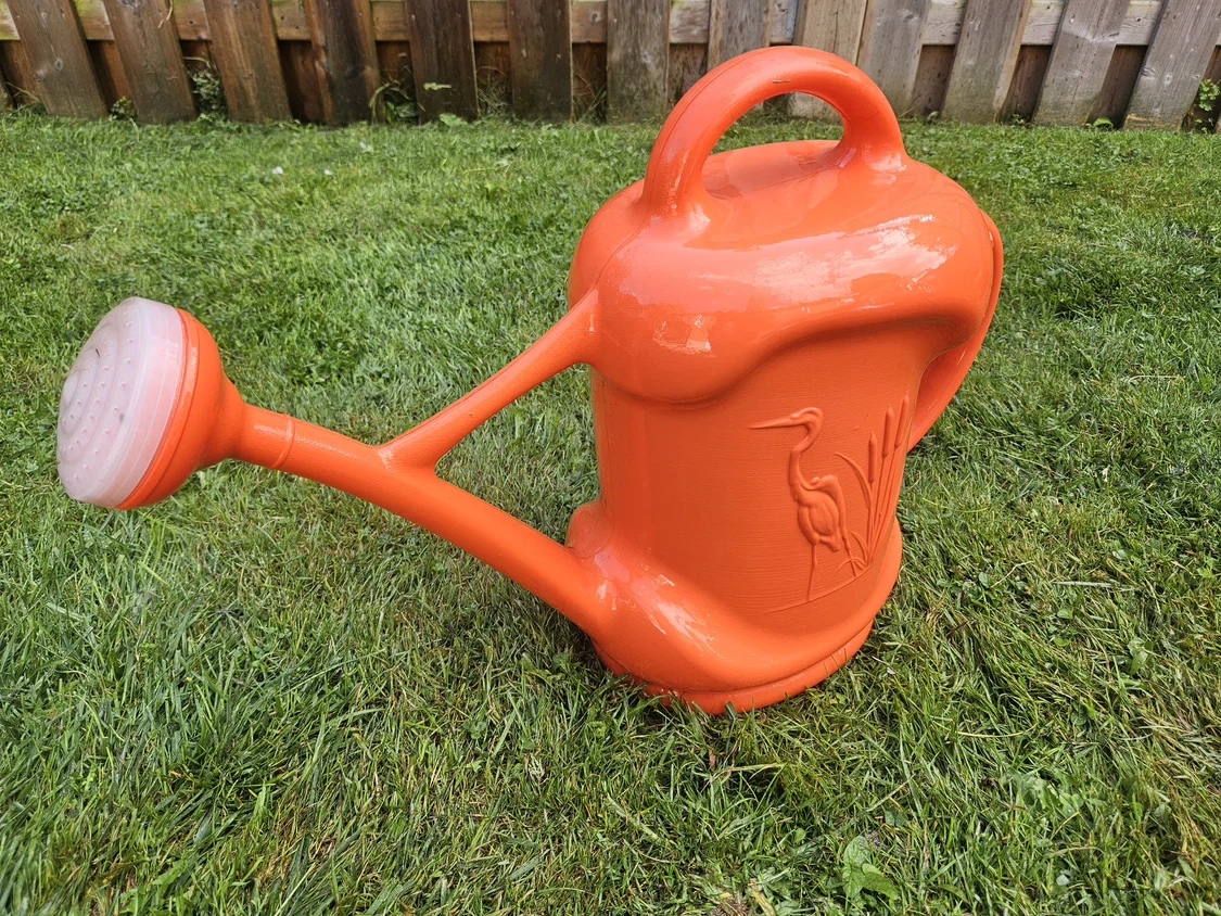 Orange Watering Can with Crane Design