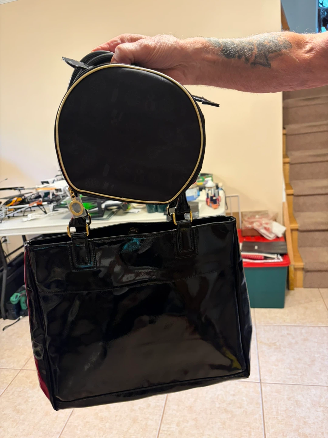 Black patent tote bag with matching round cosmetic bag