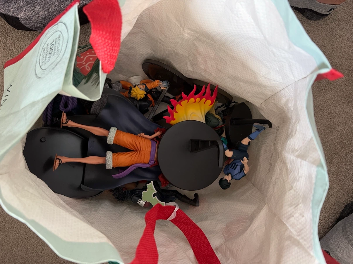 Bag filled with anime statues if interested let me know