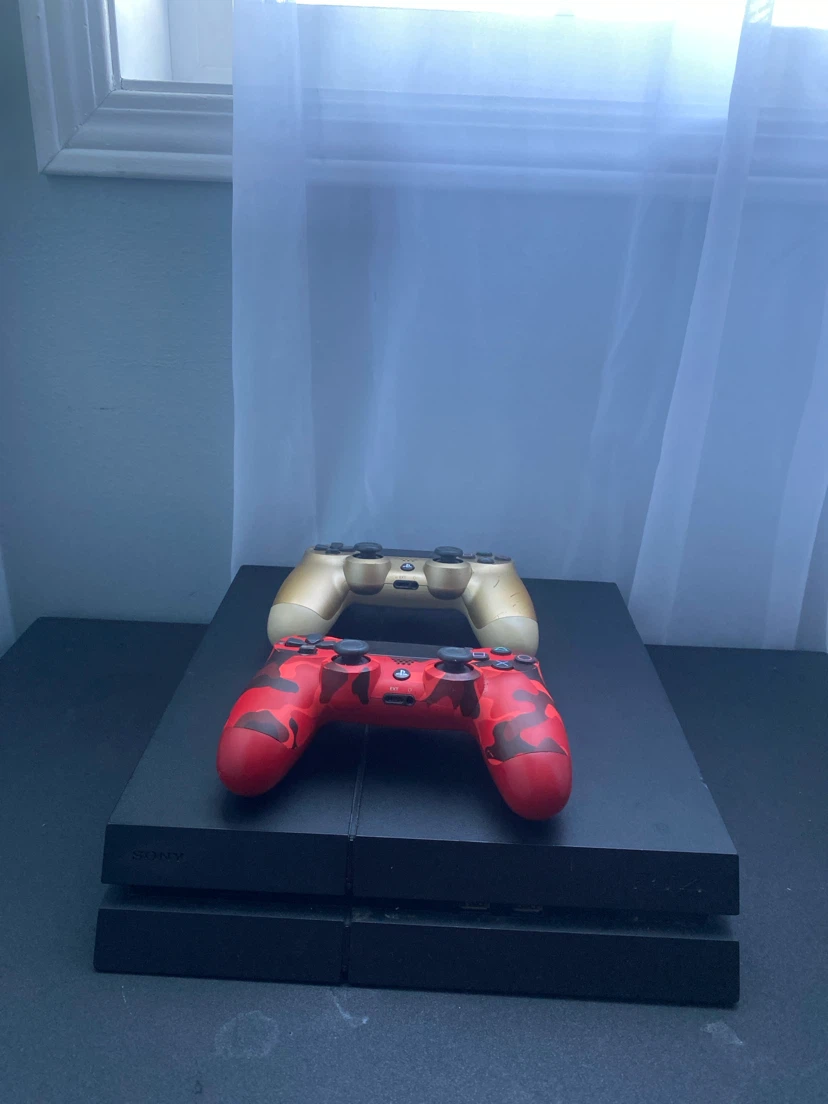 Sony PlayStation 4 Console with Two Controllers