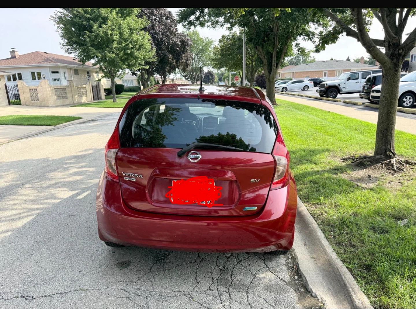 Red Nissan Versa note 2015