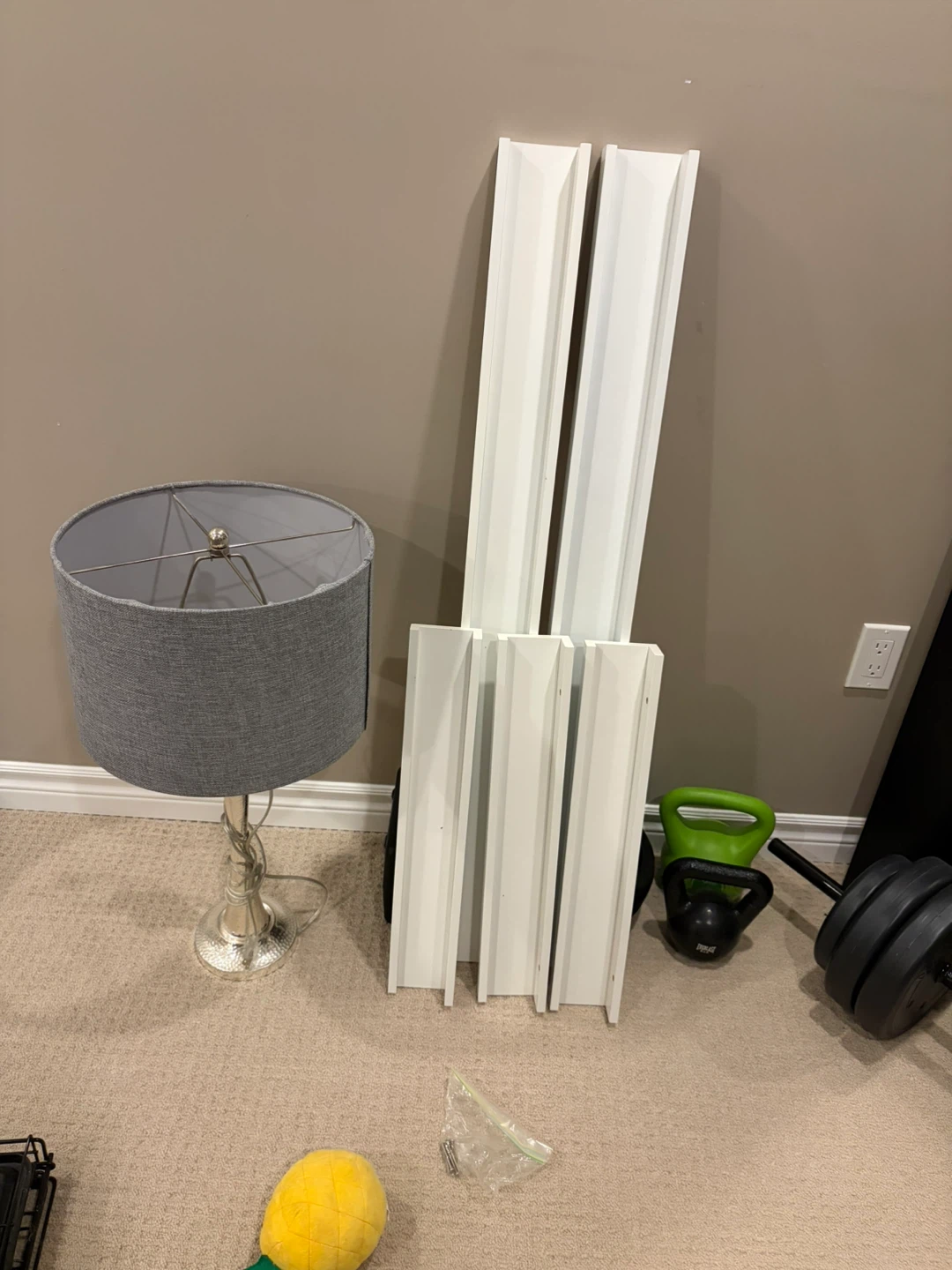 White Wooden Shelf Pieces and lamp