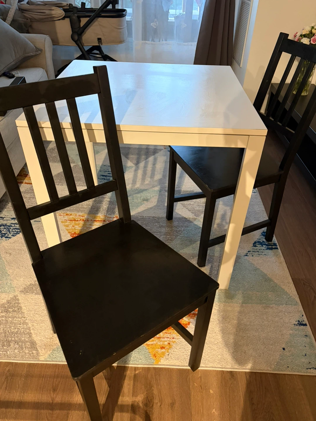 White Dining Table with Black Chairs