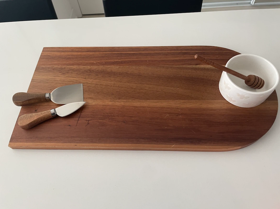 Wooden Cheese Board with Knives and Honey Pot