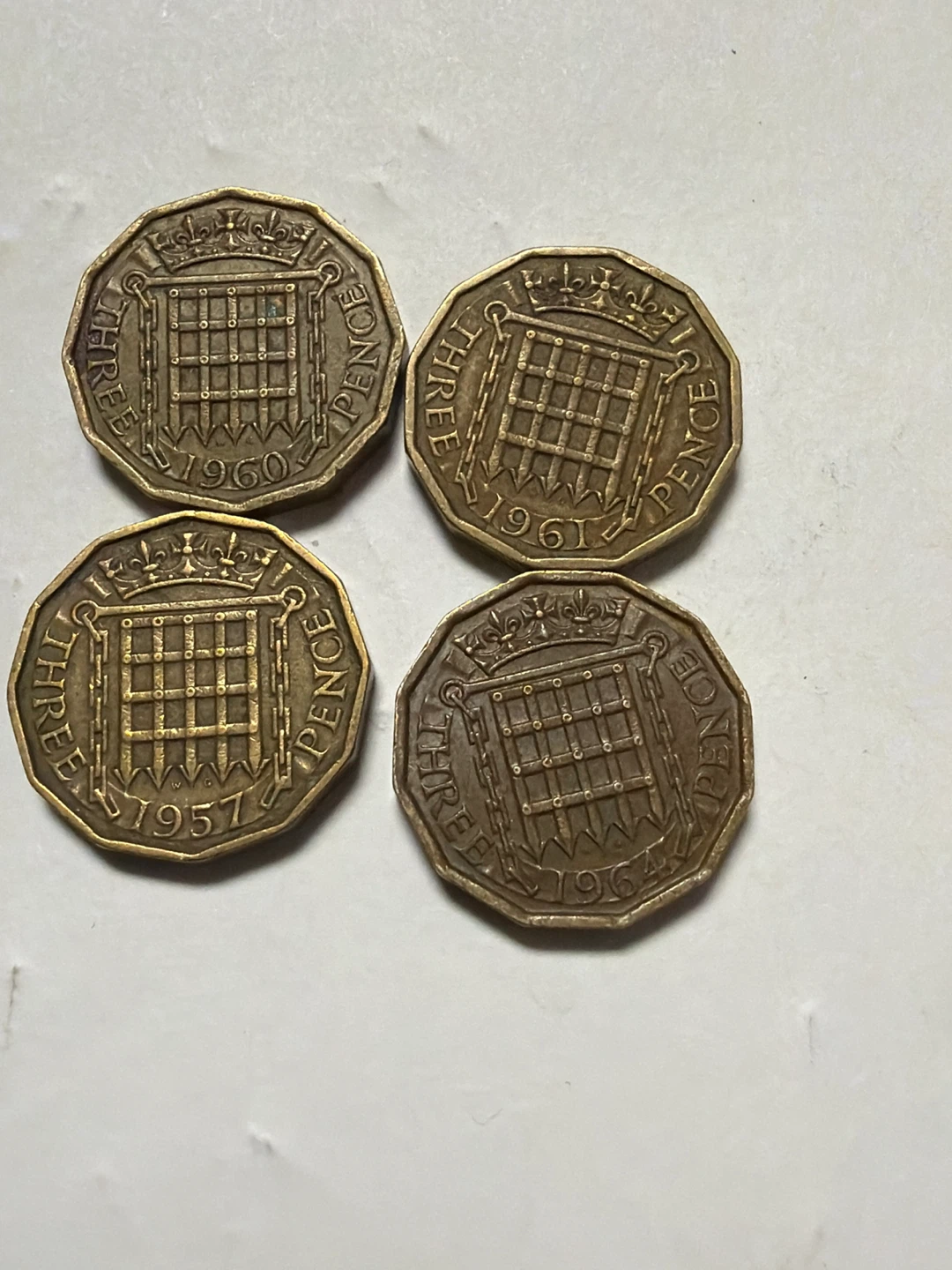 Four British Three Pence Coins