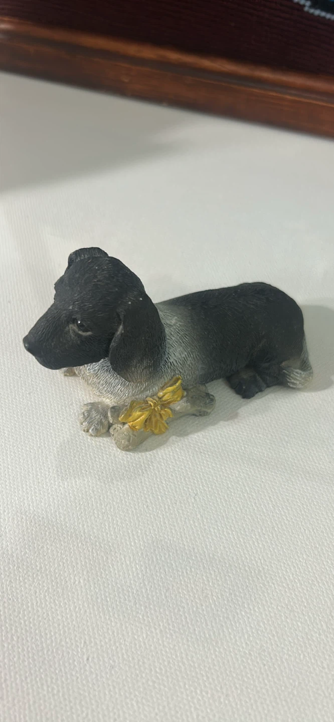 Figurine of a Dachshund dog with a bone