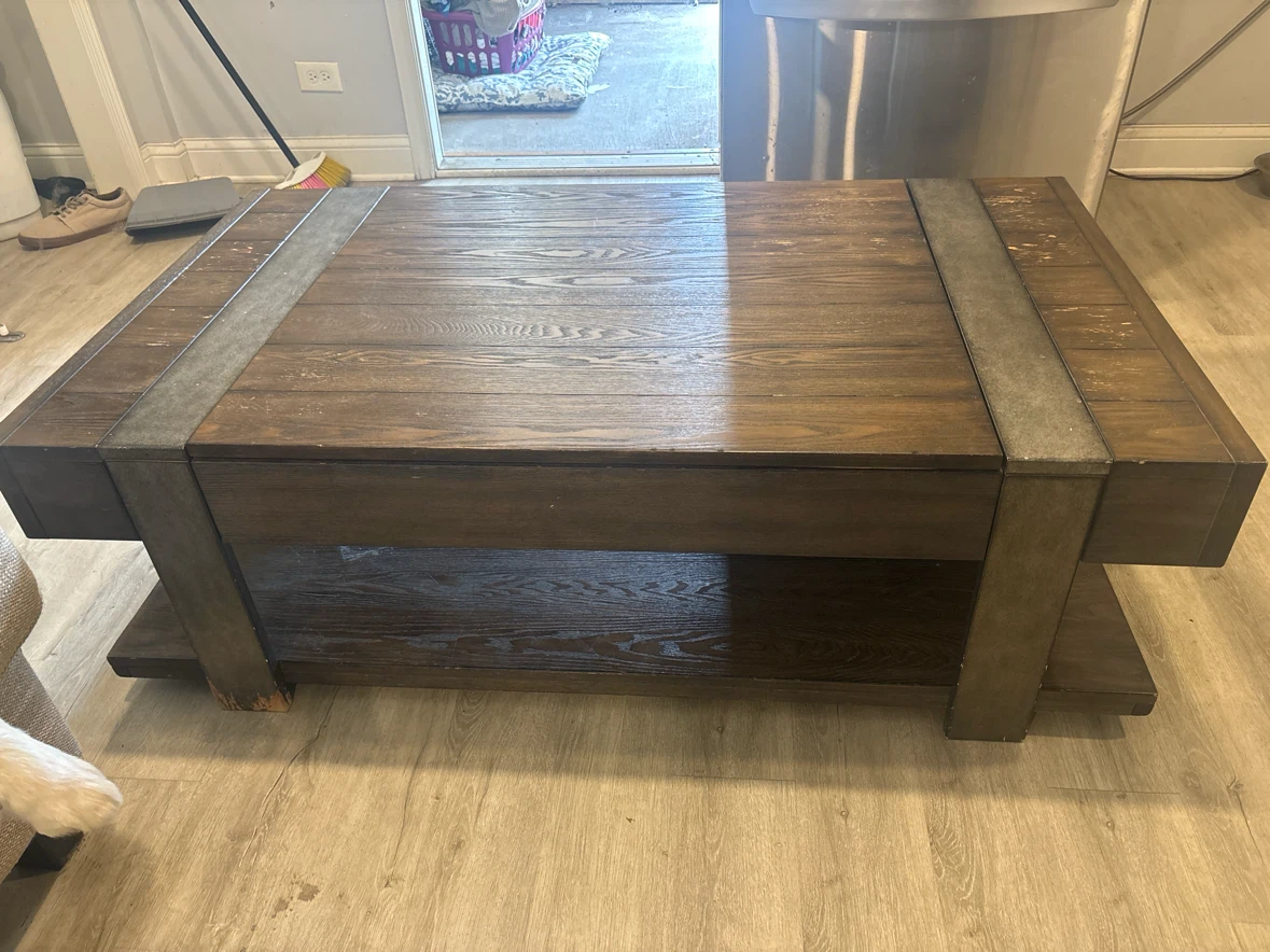 Big Lift Top  wood Coffee Table used has wheels