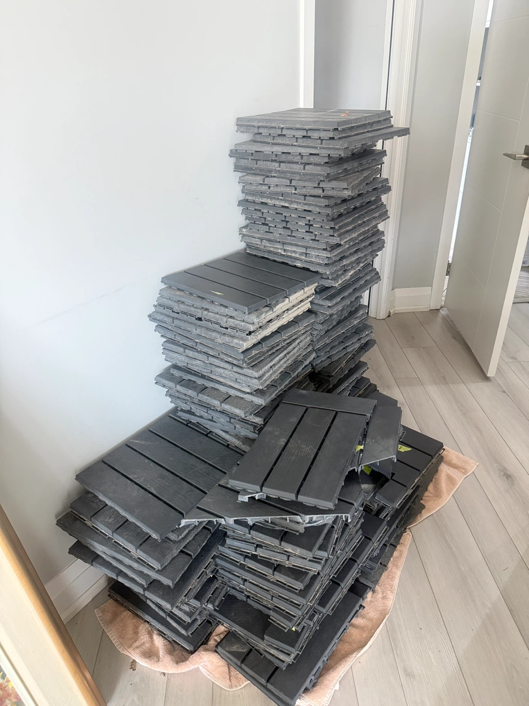 Stack of Dark Grey Interlocking Deck Tiles