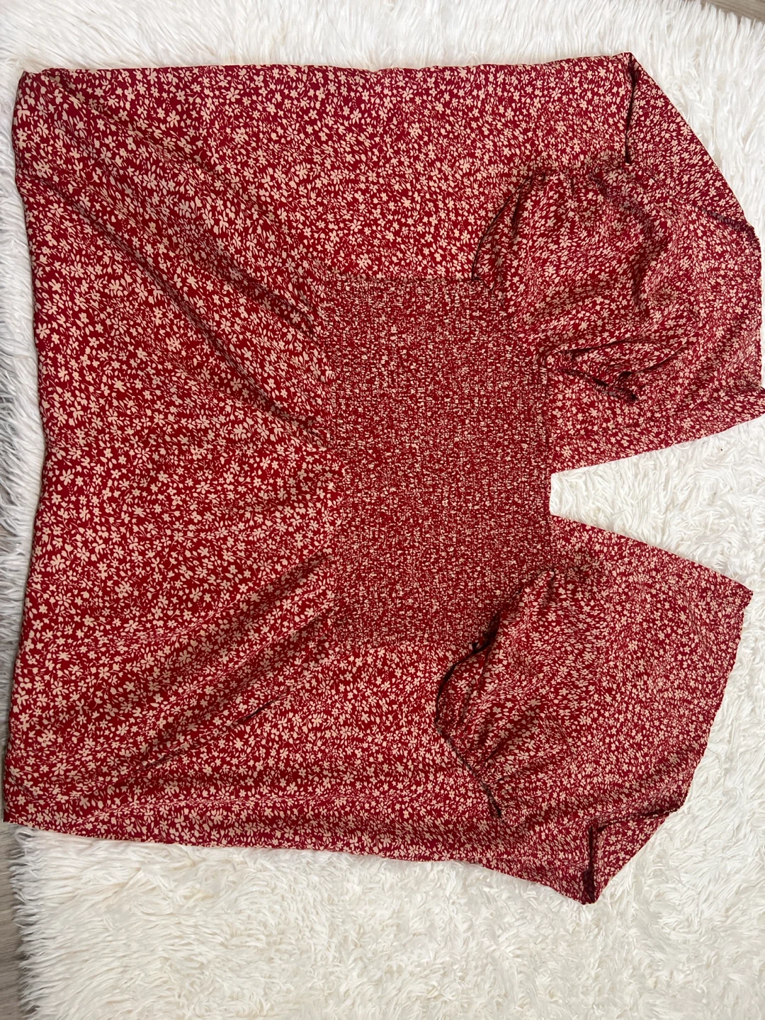 Red floral smocked long-sleeve top
