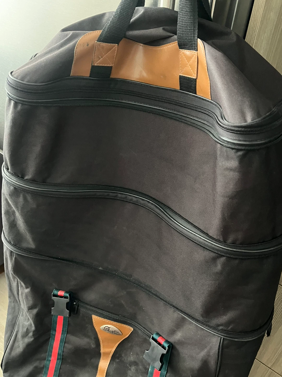 Black Rolling Duffle Bag with Leather Accents