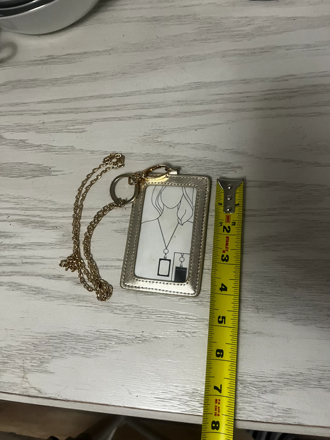 vertical ID badge holder with a chain lanyard