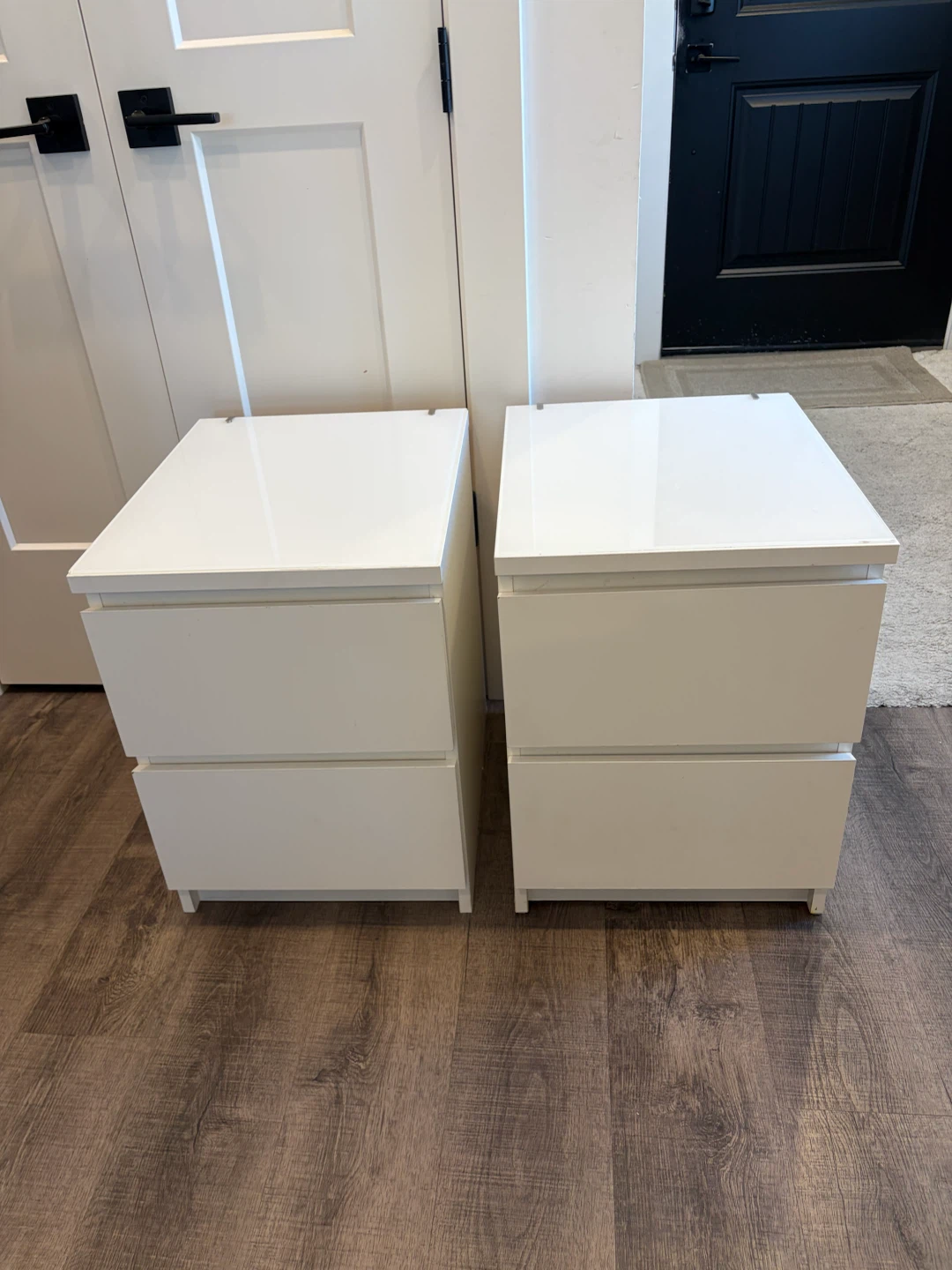 pair of IKEA nightstands with glass top