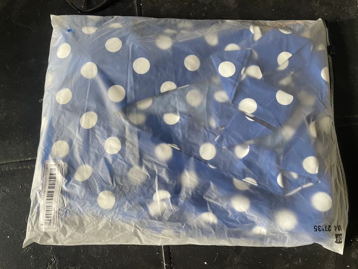 Blue v-neck dress with white polka dots. - photo 4