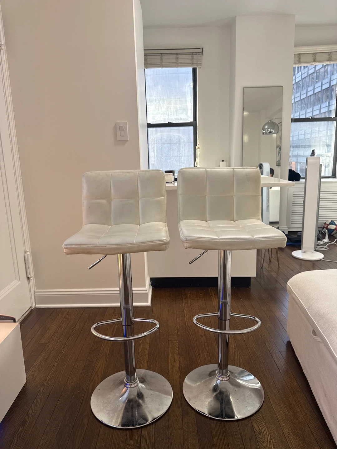 2 white bar stools
