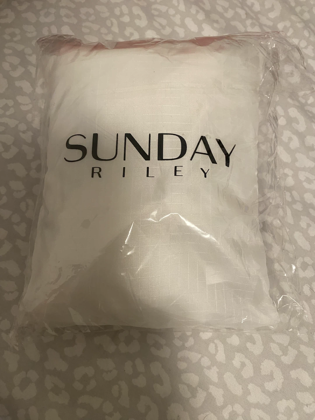 New /unused Sunday Riley Raincoat