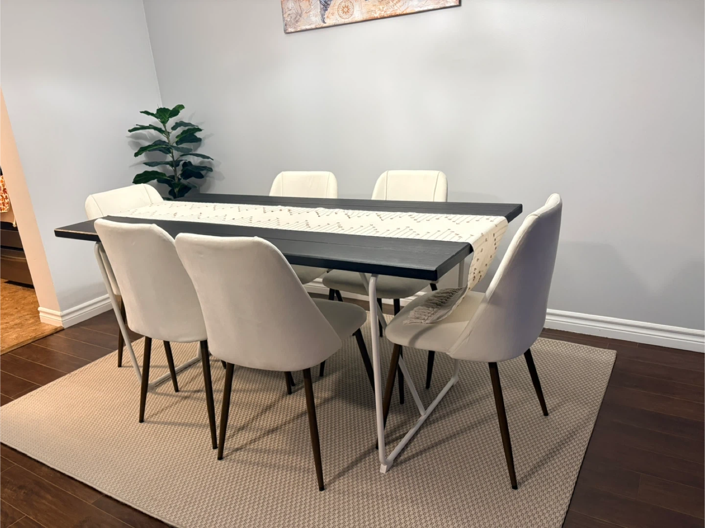 Black Dining Table with Beige Chairs
