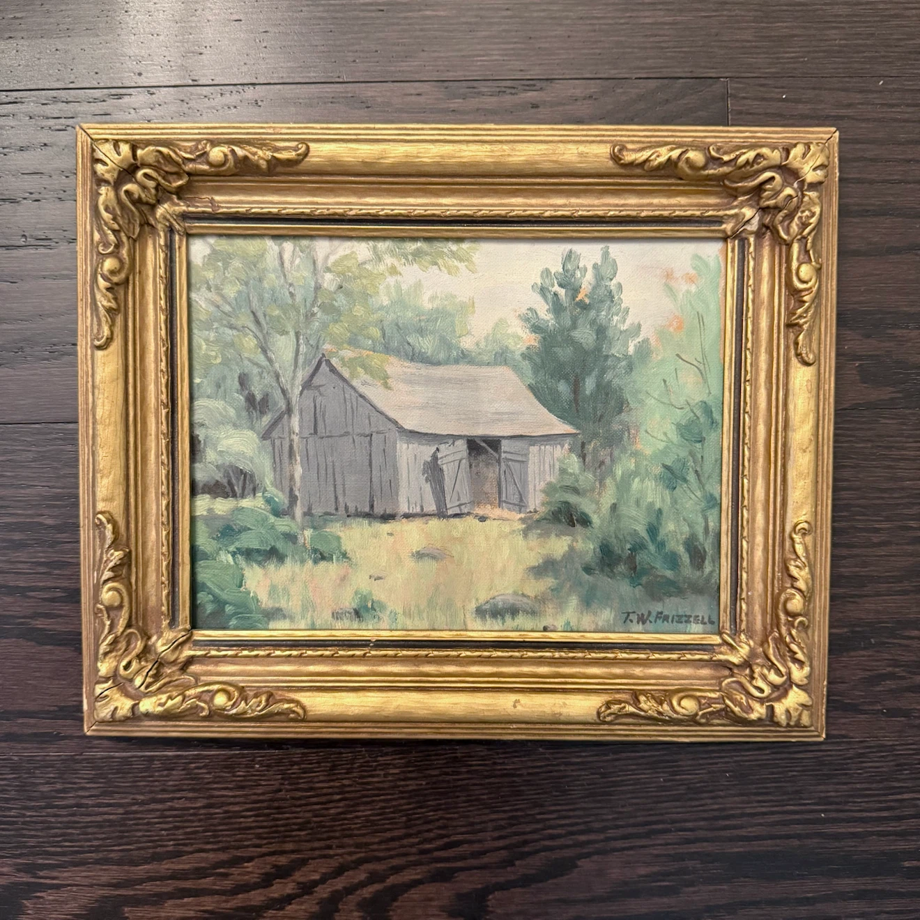 Small landscape oil painting in gilt frame