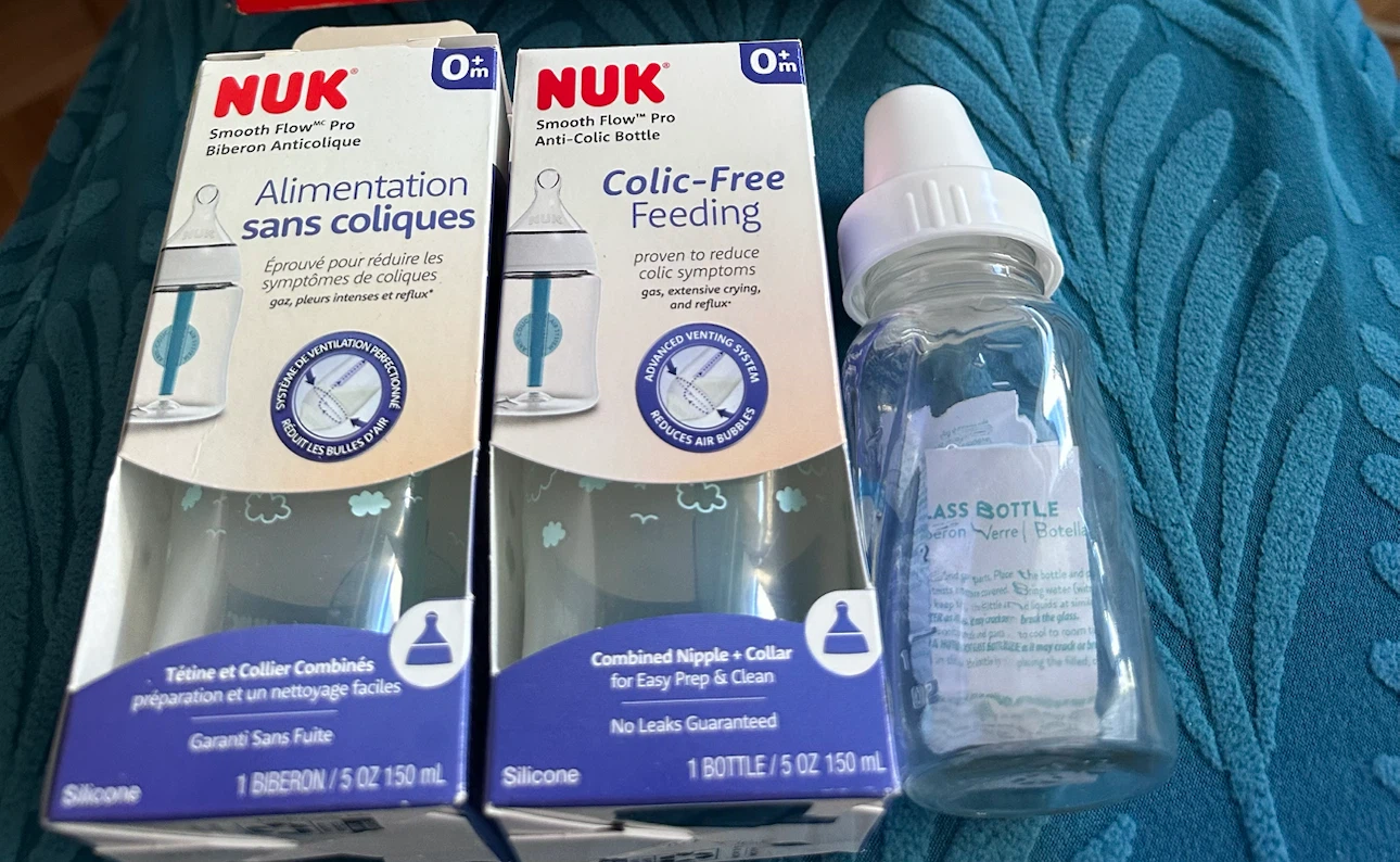 BRAND NEW feeding bottles- NUK and evenflo