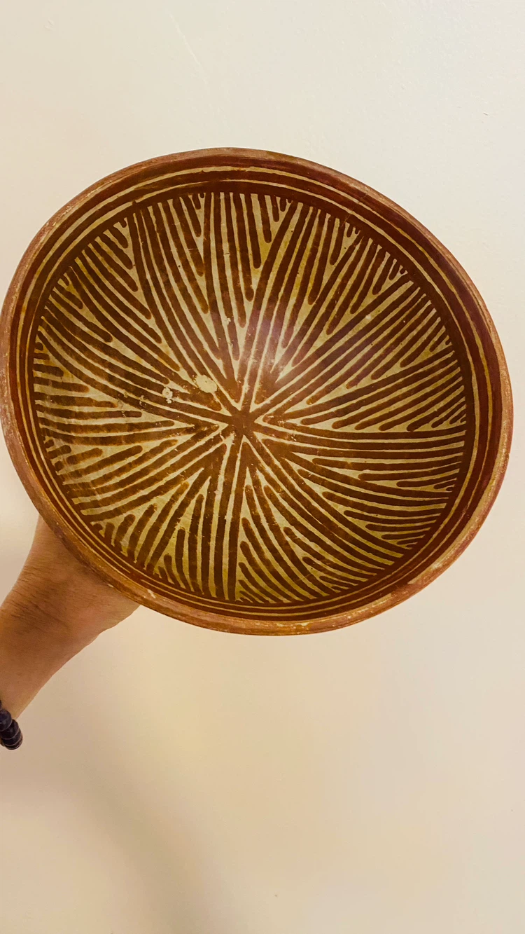 Vintage pottery footed bowl with chip