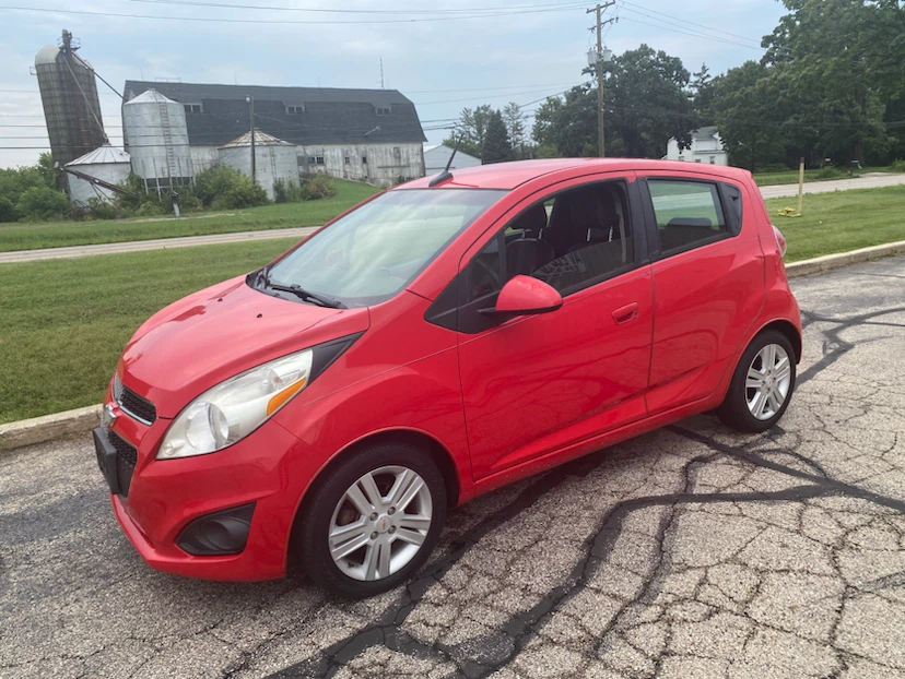 Red Chevrolet Spark Hatchback