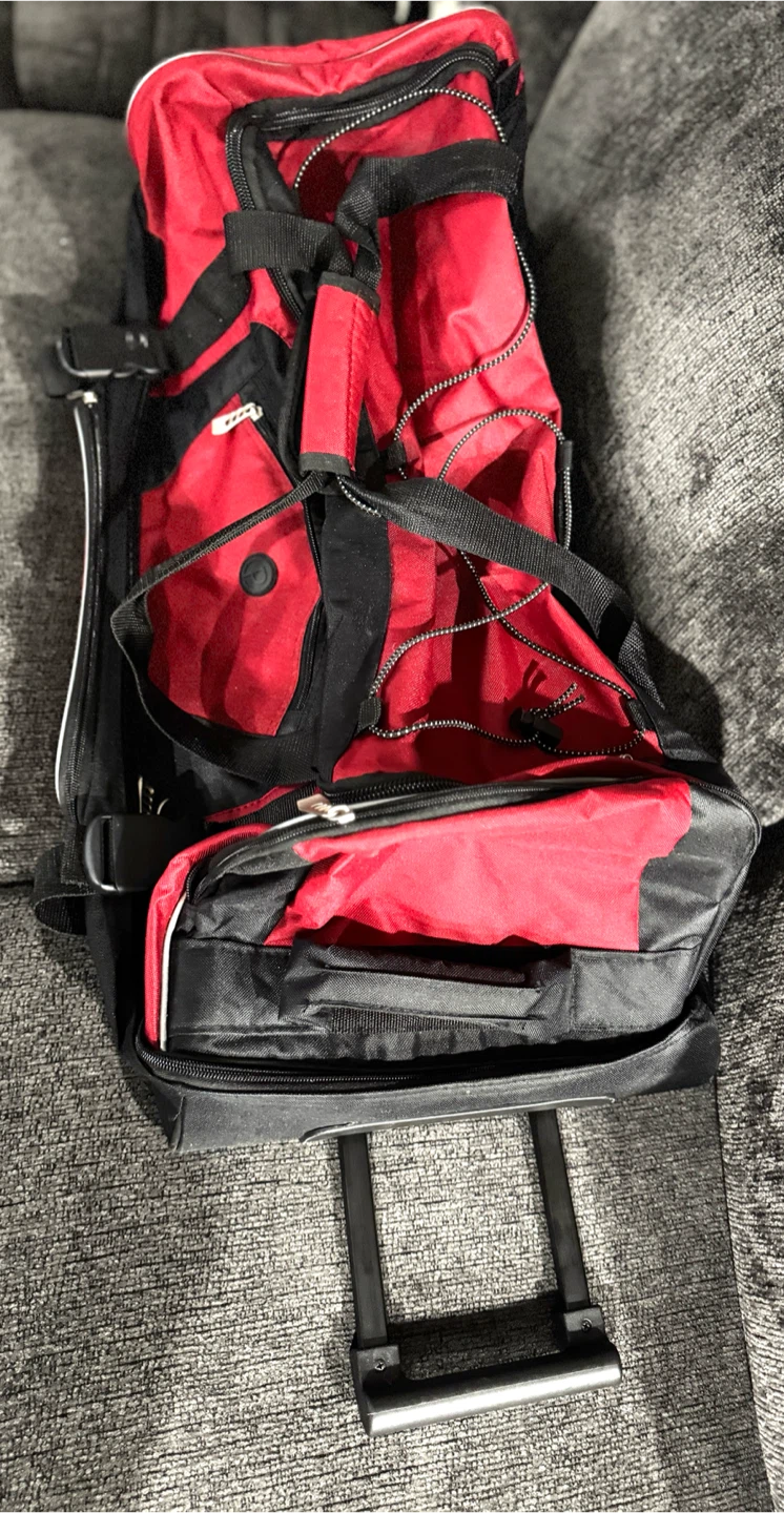 Red and Black Rolling Duffel Bag on wheels