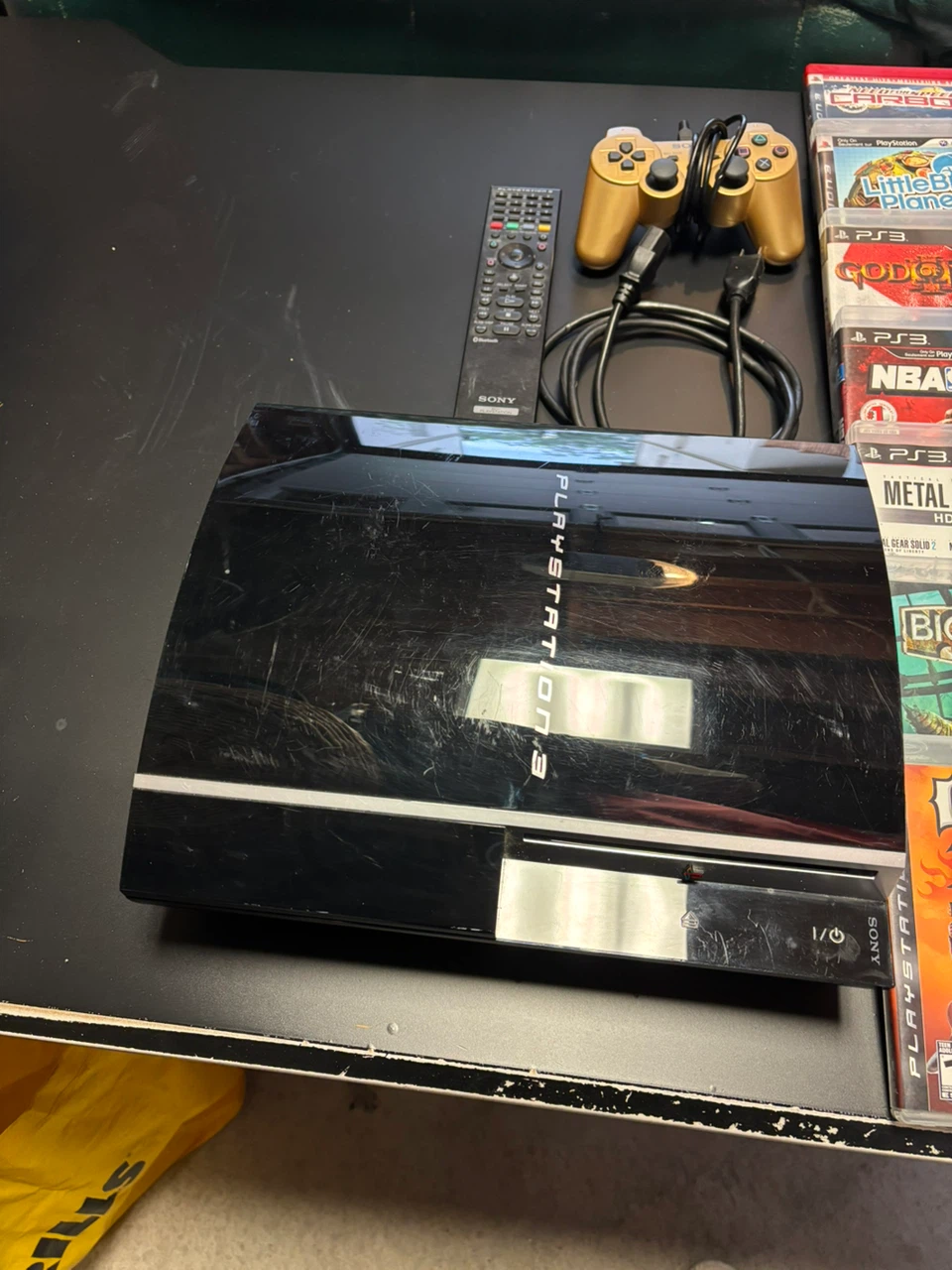 PlayStation 3 Console with Games and Gold Controller