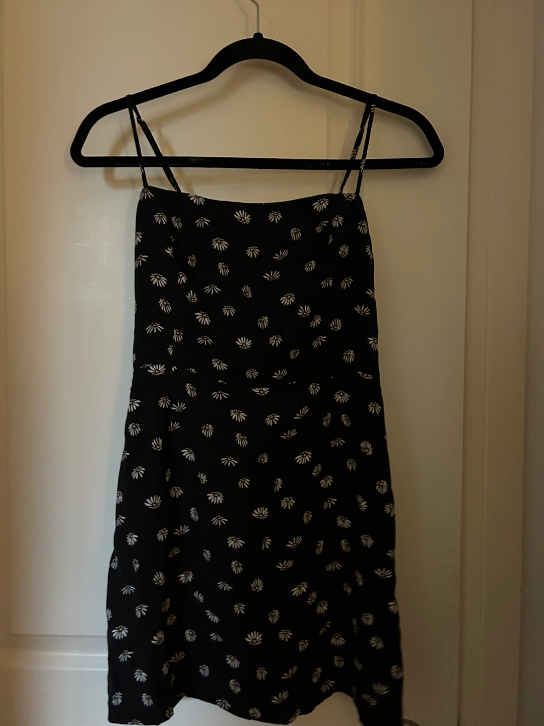 Black dress with white daisy print