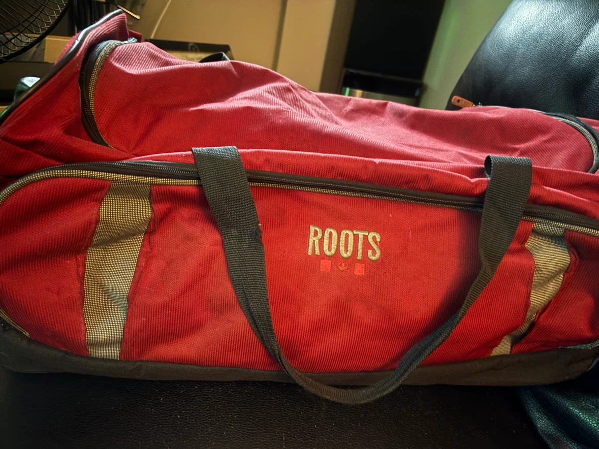 Roots Red Rolling Duffel Bag