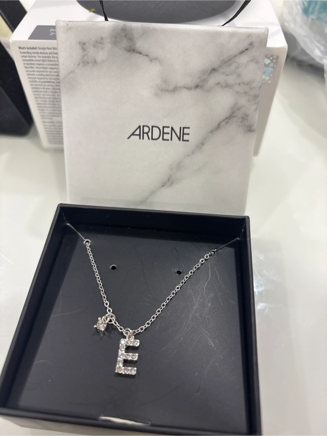 Ardene silver necklace with 'E' charm