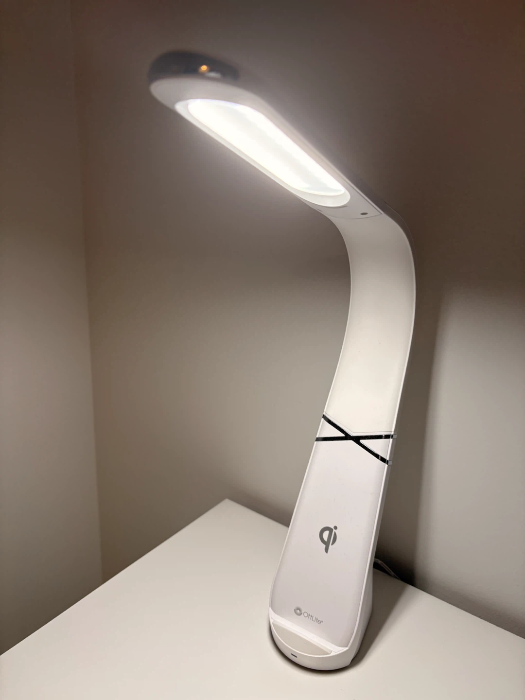 LED desk lamp with wireless phone charging.”