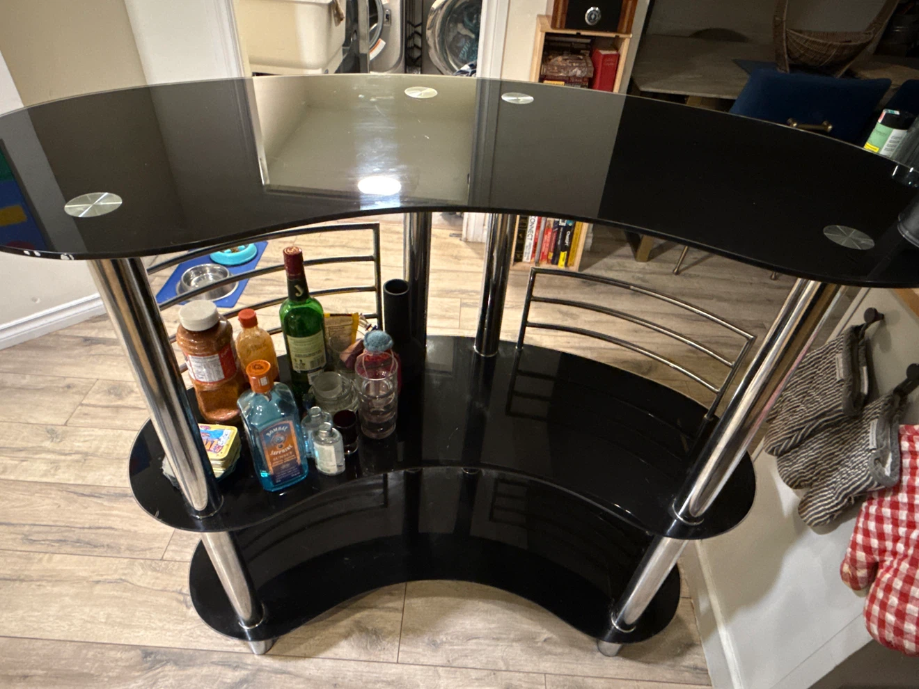 Black glass bar cart with chrome accents