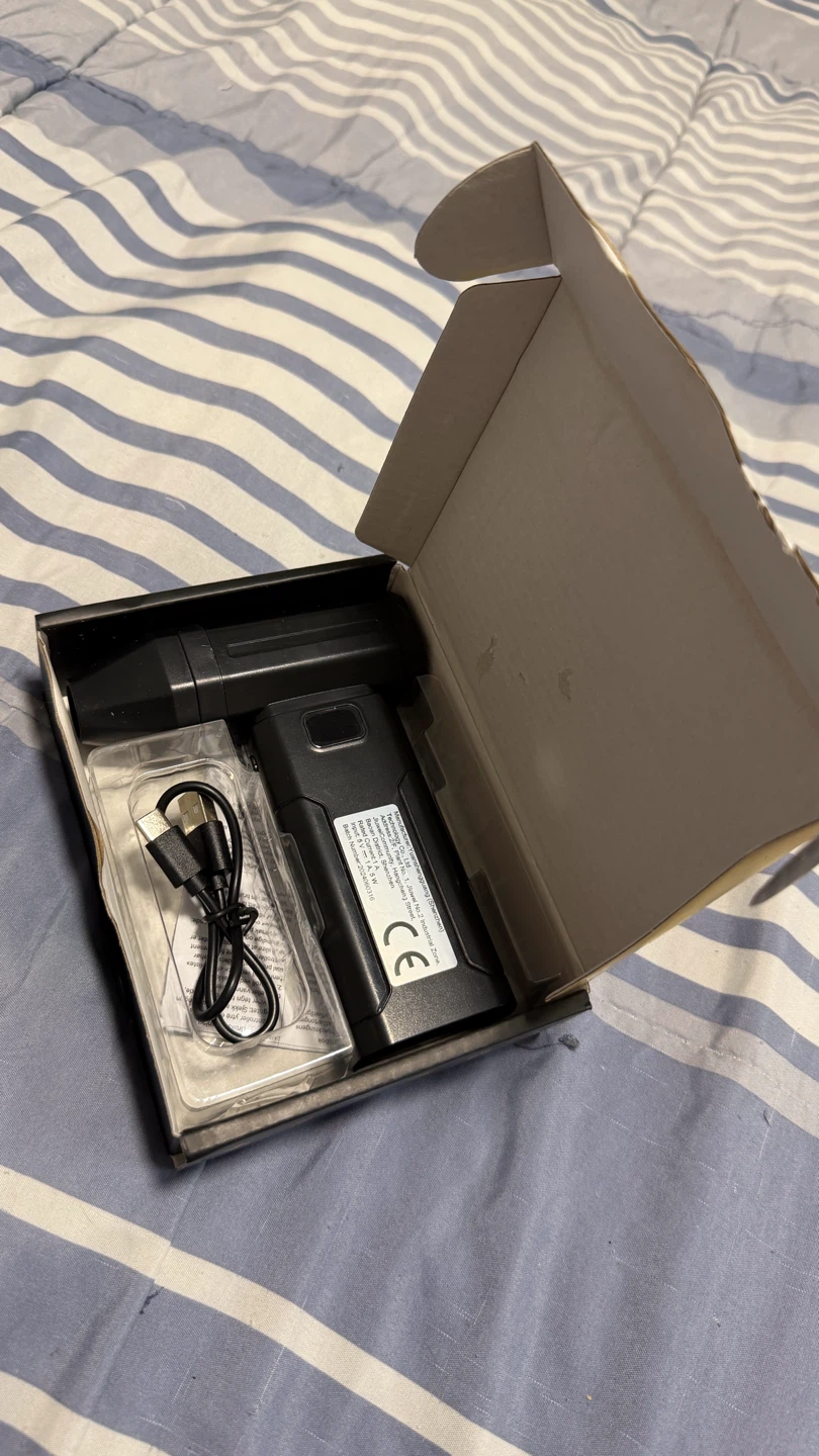 Black Rechargeable Device with USB Cable