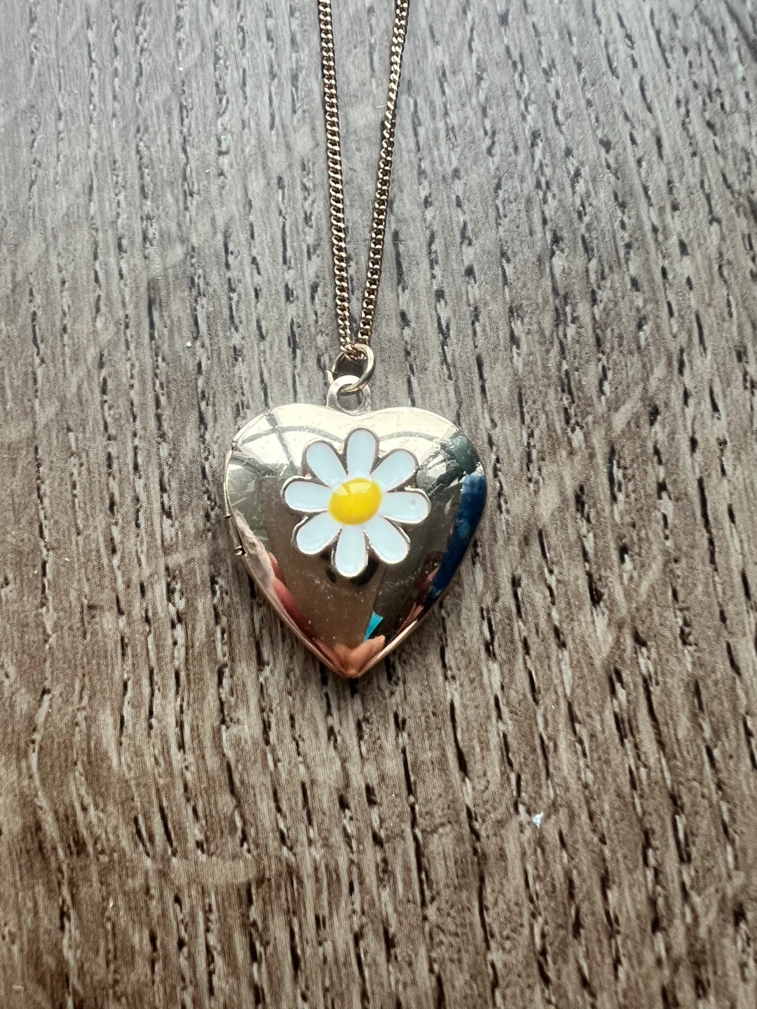 Claire’s heart locket with flower