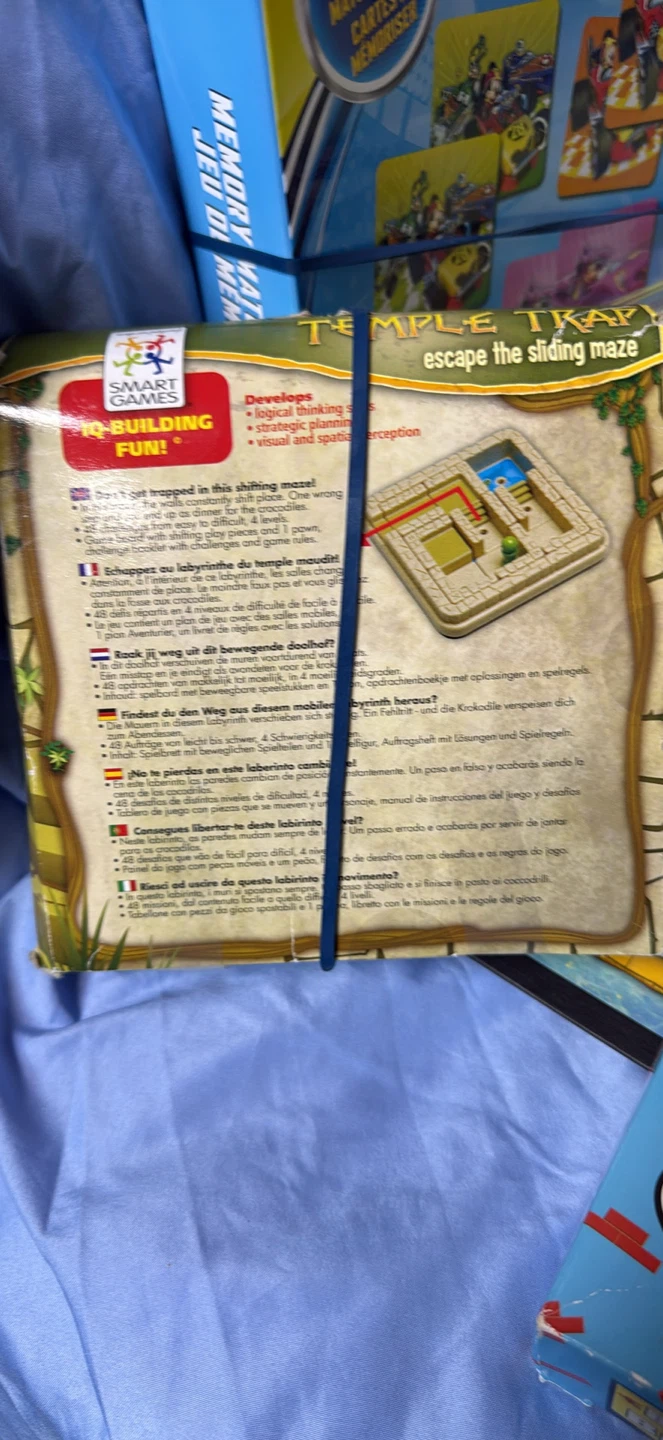 Box full of games for children. Temple Trap, kerplunk, and more