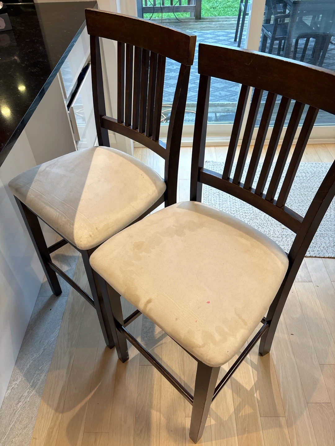 Two Dark Wood Bar Stools with Cream Cushions