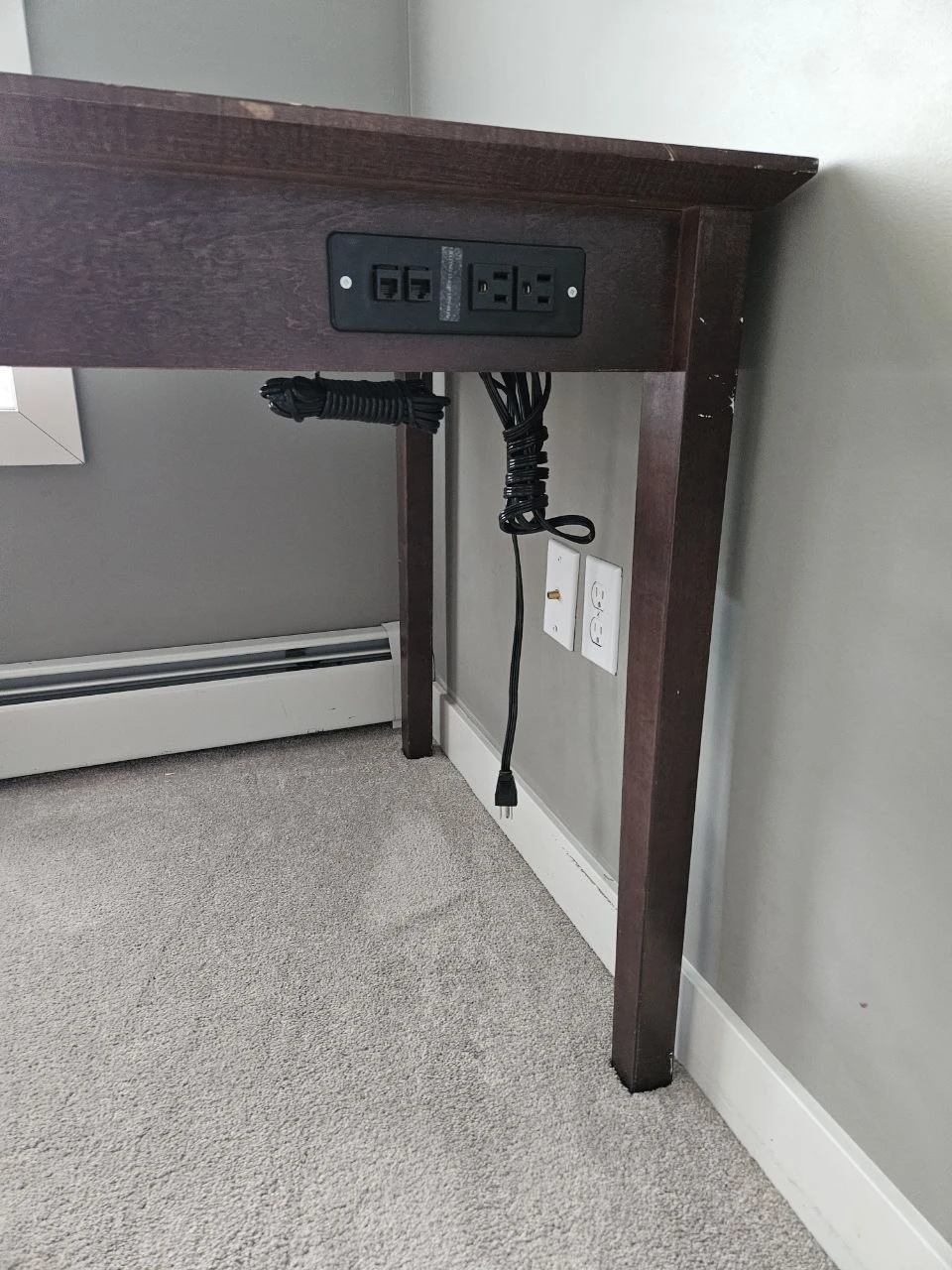 Dark wood desk with built-in power outlets - photo 2